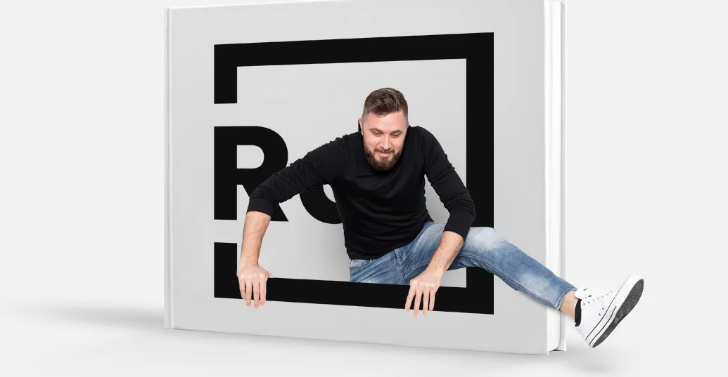 man climbing out of branded book