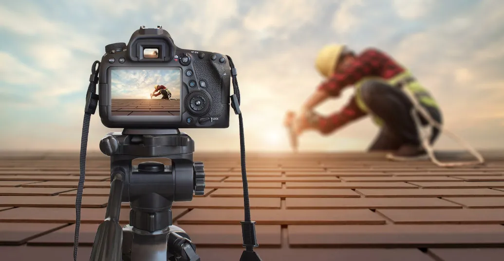 camera on roof with roofer